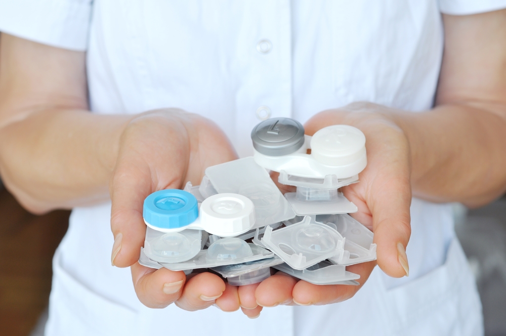 A person holding a couple of contact lenses - Contact Lenses in Grand Rapids