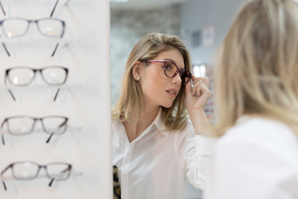 Woman fitting eye glasses - Eyeglasses in Grand Rapids